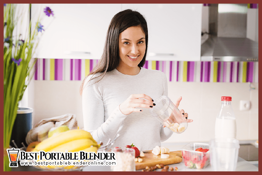 Girl-preparing peanut-butter-banana smoothie-best-portable-blender-online