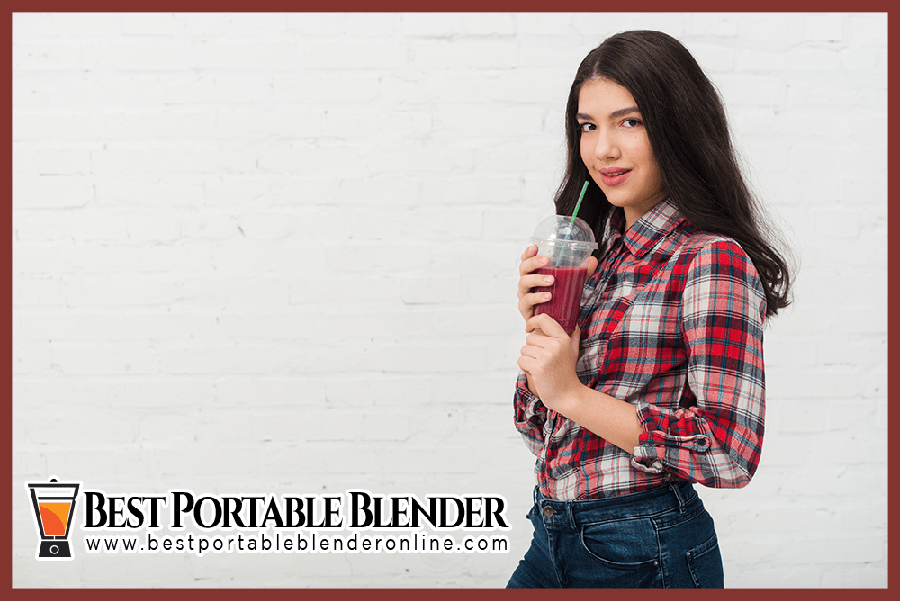 black-hair-girl-enjoying-blueberry-banana-smoothie-best portable-blender-online