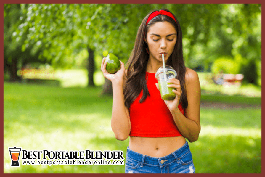 girl-in-red-top-drinking-green-smoothie-with-avocado-and-spinach