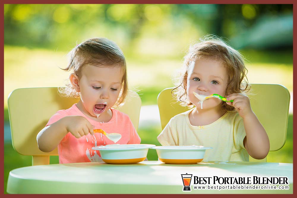 toddlers-eating-baby-food-in-the-outdoor